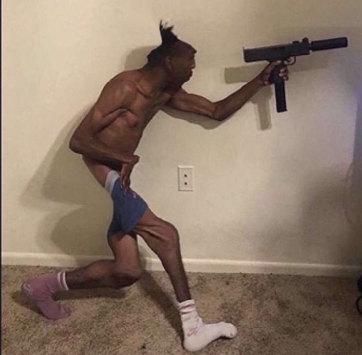 skinny black hood guy holding uzi indoors dank 